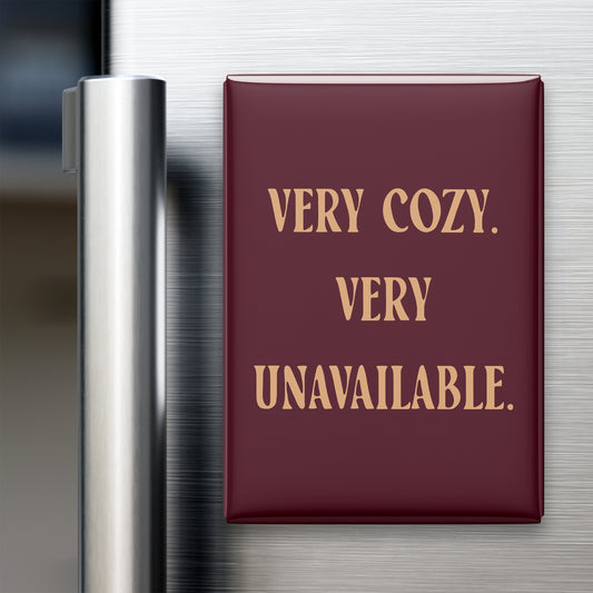 “Very cozy. Very unavailable.” quote magnet displayed on a refrigerator