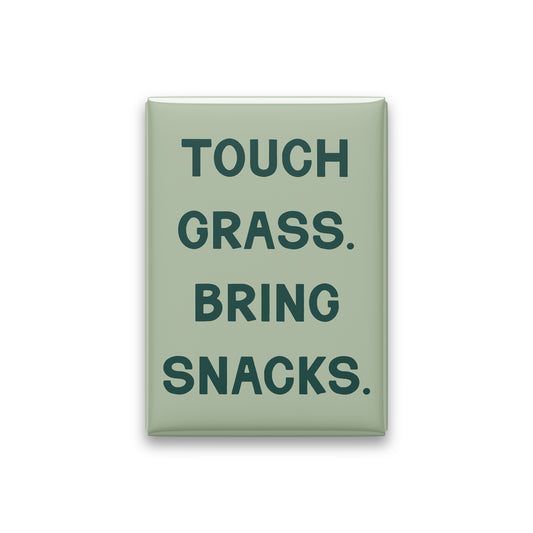 “Touch grass. Bring snacks.” sage quote magnet on white