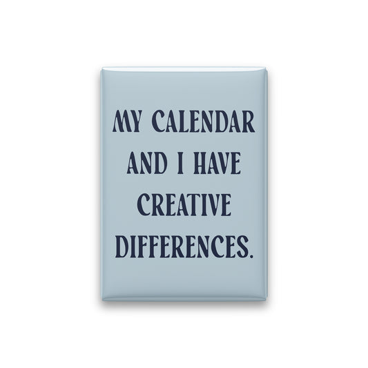 “My calendar and I have creative differences.” powder quote magnet on white