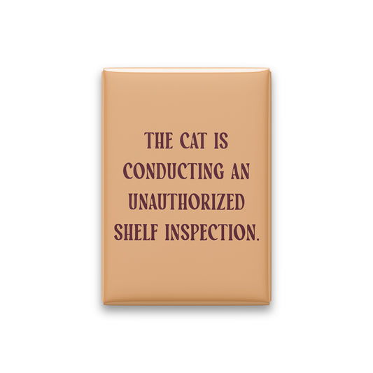 “The cat is conducting an unauthorized shelf inspection.” apricot quote magnet on white