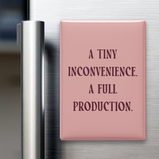 “A tiny inconvenience. A full production.” quote magnet displayed on a refrigerator