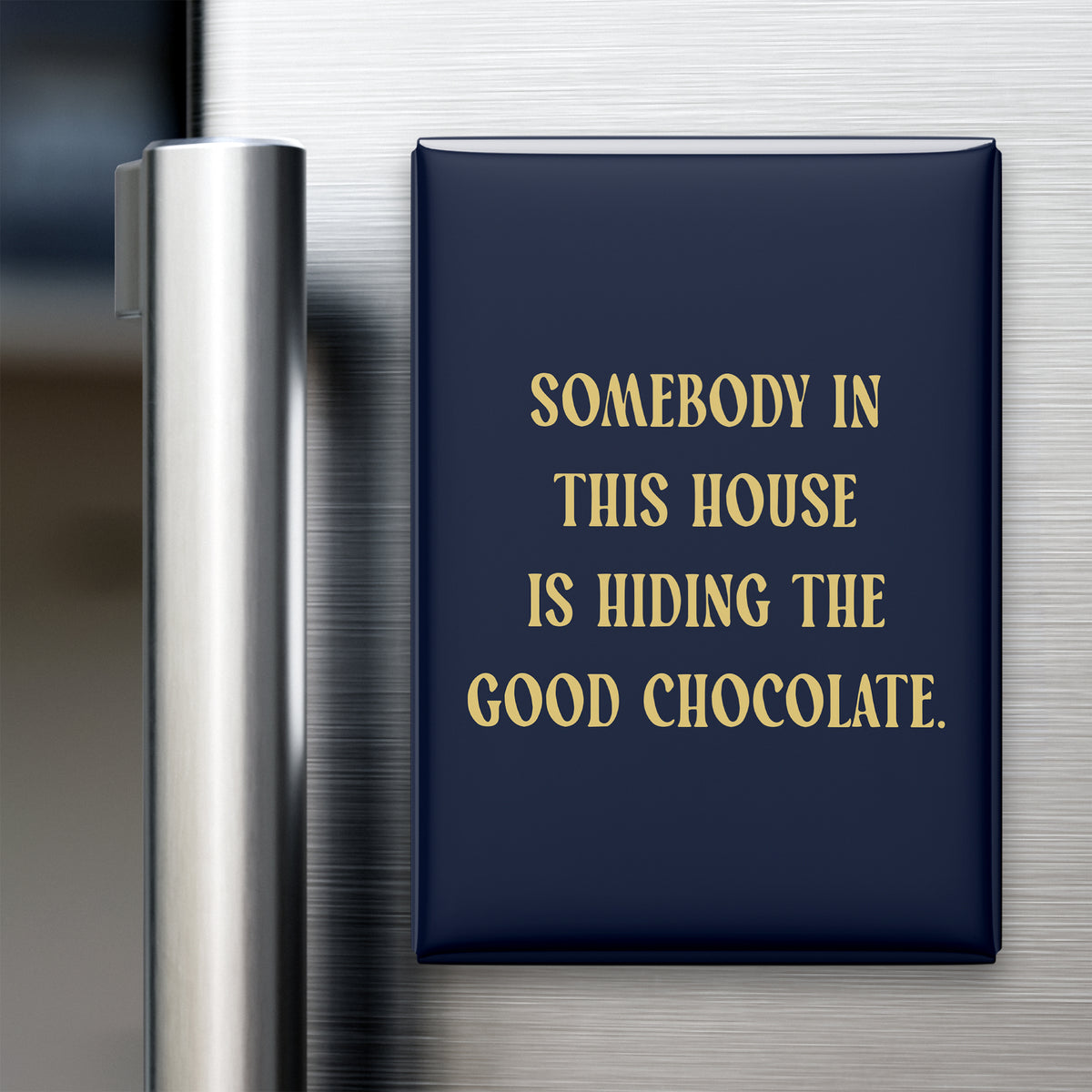 “Somebody in this house is hiding the good chocolate.” quote magnet displayed on a refrigerator