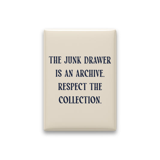 “The junk drawer is an archive. Respect the collection.” parchment quote magnet on white