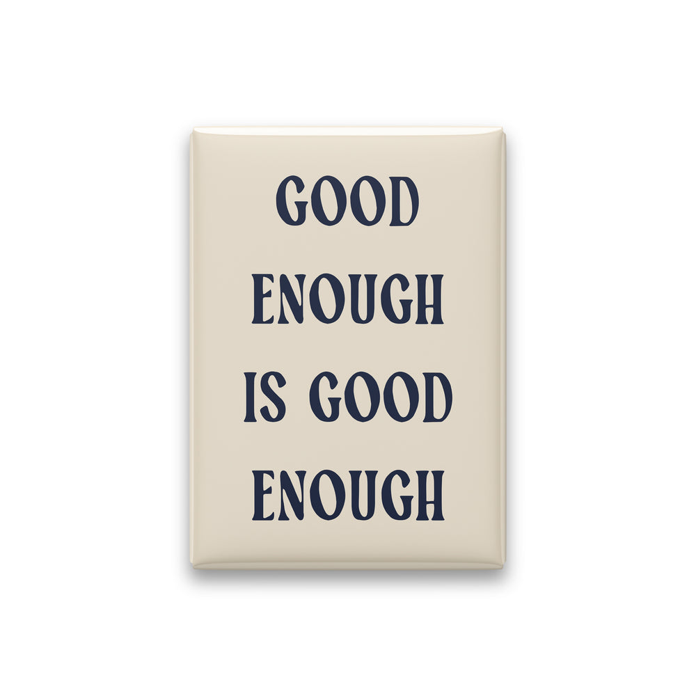 Good Enough Is Good Enough magnet in Midnight lettering on a Parchment background, shown on white