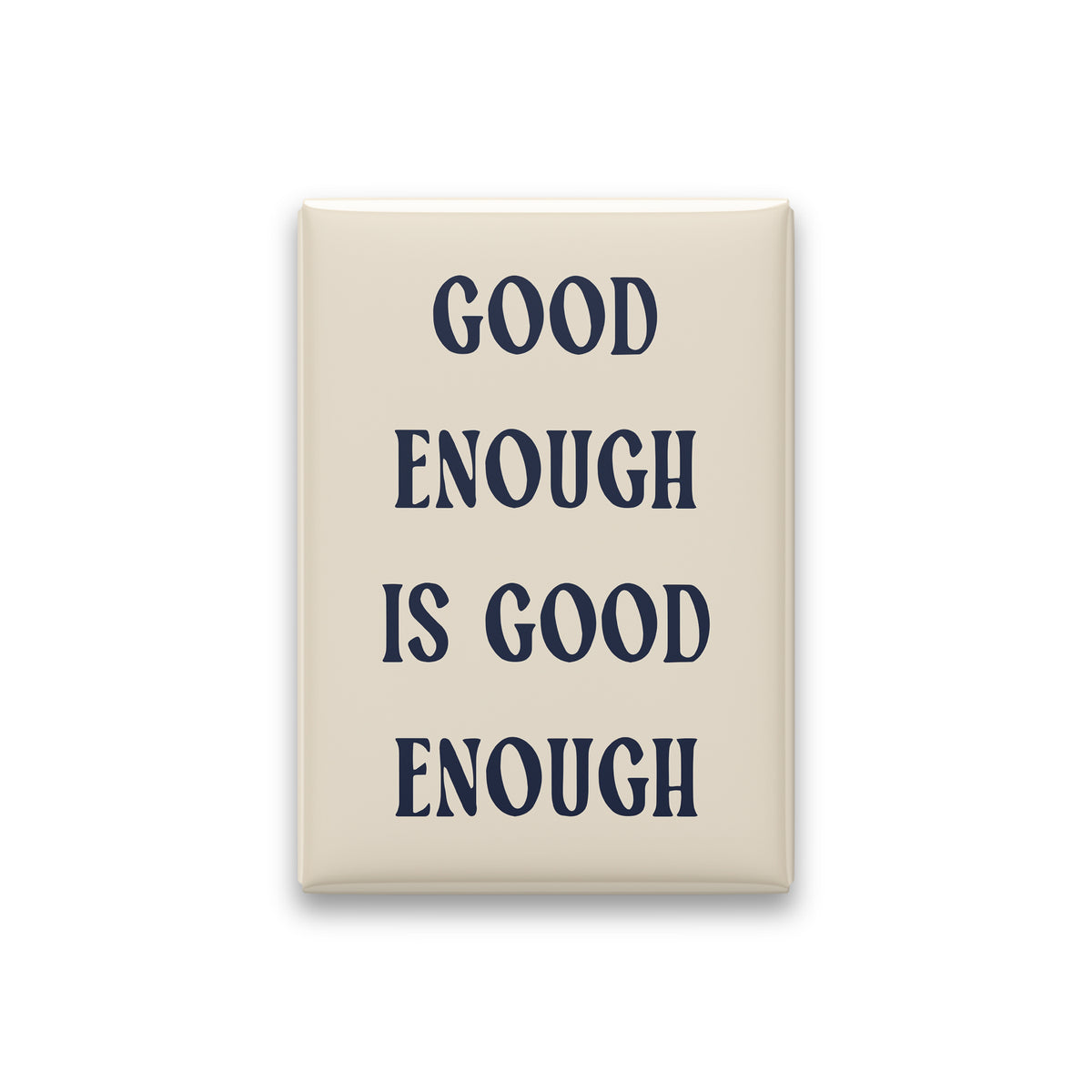 Good Enough Is Good Enough magnet in Midnight lettering on a Parchment background, shown on white