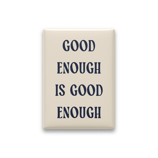 Good Enough Is Good Enough magnet in Midnight lettering on a Parchment background, shown on white