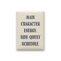 Main Character Energy. Side Quest Schedule magnet in Midnight lettering on a Parchment background, shown on white