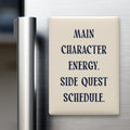 Main Character Energy. Side Quest Schedule magnet in Midnight lettering on a Parchment background, displayed on a refrigerator