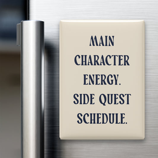 Main Character Energy. Side Quest Schedule magnet in Midnight lettering on a Parchment background, displayed on a refrigerator