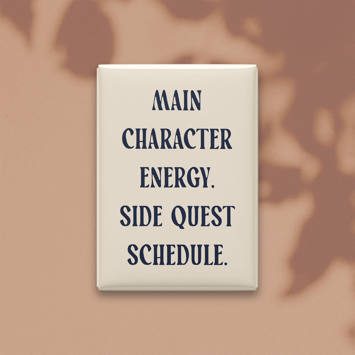 Main Character Energy. Side Quest Schedule magnet in Midnight lettering on a Parchment background, shown on a warm neutral background