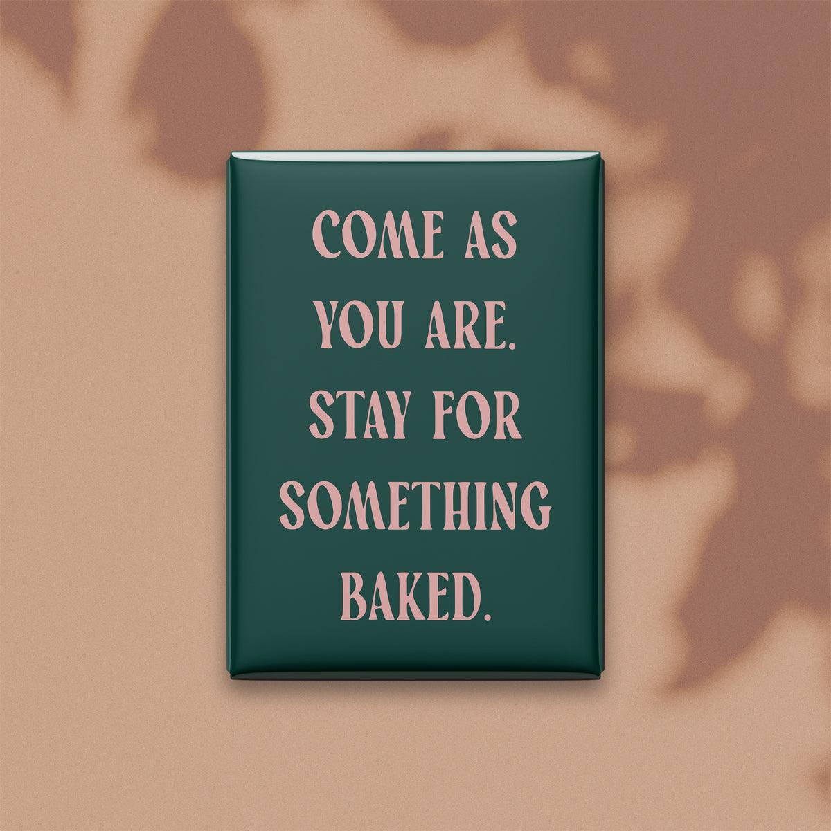 Come as you are. Stay for something baked. Small Talk magnet on a warm neutral background