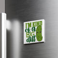 A humorous refrigerator magnet with the text "I'm kind of a big dill" and a cartoon image of a pickle.