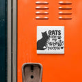 a sticker with the text "CATS are my favorite people" on an orange surface, with a silhouette of a cat and paw prints.