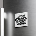 A white refrigerator magnet with the text "Sorry I have plans with my dog" printed on it.