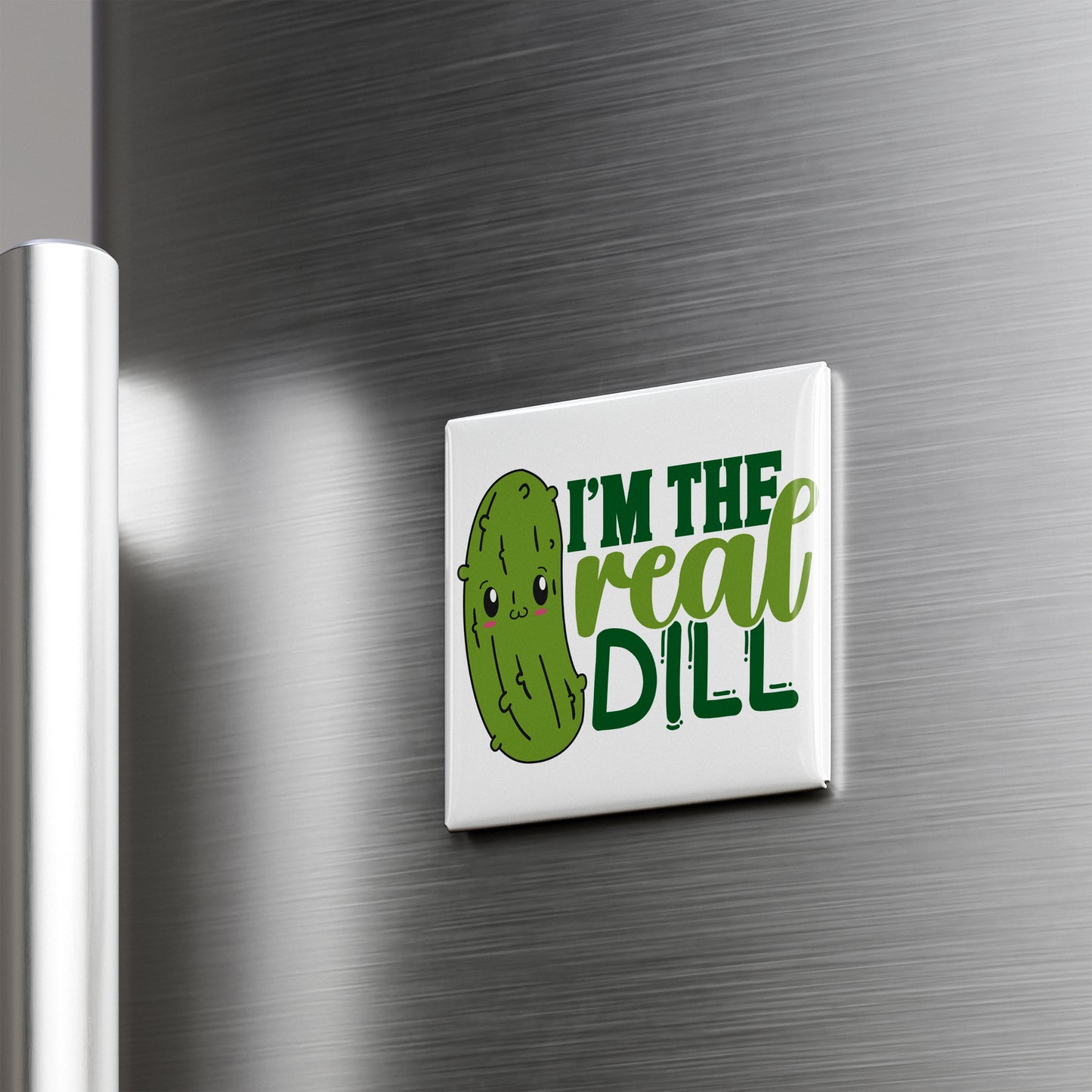 A refrigerator door with a humorous text sticker that reads "I'm the real dill".