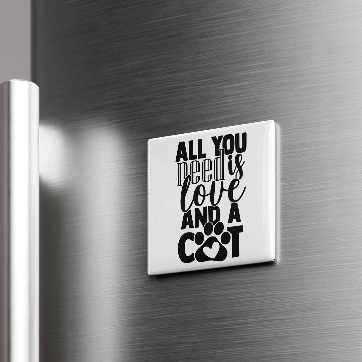 A white magnet with the text "ALL YOU NEED IS LOVE AND A COOT" is attached to a metallic surface.