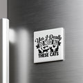 A refrigerator door with a humorous text sticker that reads "Yes, I Really Do Need All These Cats".
