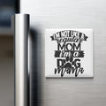 A white refrigerator magnet with the text "I'M NOT LIKE A REGULAR MOM I'M A DOG MAMA" printed on it.