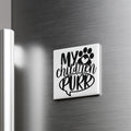 A refrigerator door with a sticker or decal that says "My children purr" along with a paw print symbol.