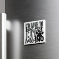 A white square magnet with black text that says "I D LOVE TO BUT MY CAT SAID NO" is attached to a metallic surface.