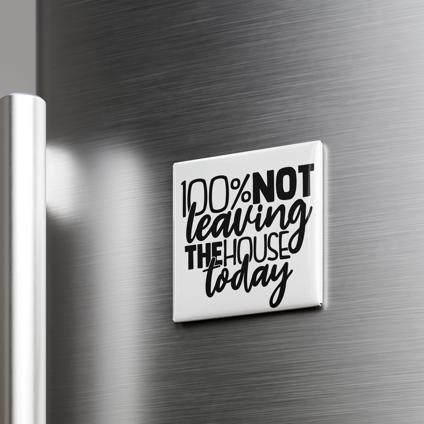 A white refrigerator magnet with the text "100% NOT Leaving THE HOUSE TODAY" printed on it.