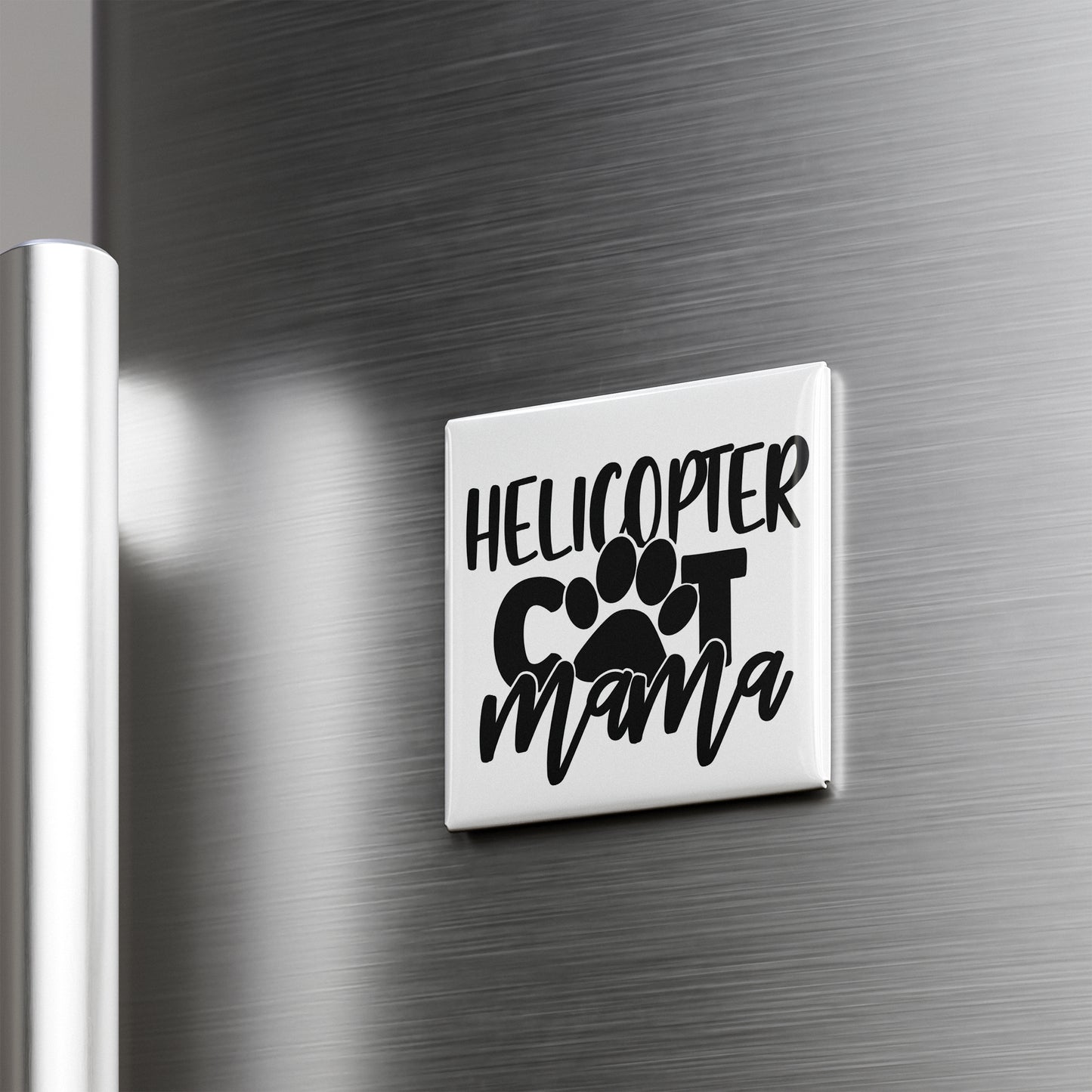 A refrigerator door with a sticker that says "HELICOPTER COT MAMA" in a stylized font.