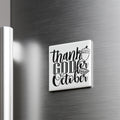 A white refrigerator magnet with the text "Thank you October" written on it.