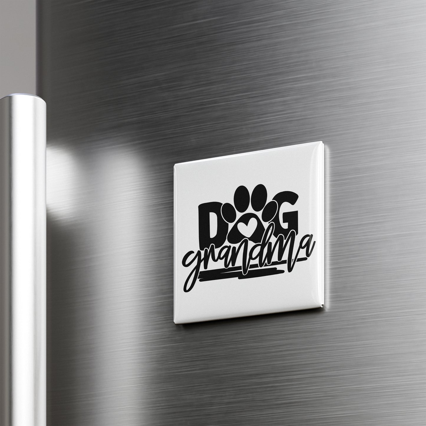 A refrigerator door with a sticker that says "DOG grandmothera" in a stylized font.