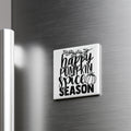 A white square magnet with black text that says "happy pumpkin spice season" is attached to a metallic surface.
