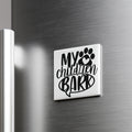 A refrigerator door with a sticker or decal that says "My children bark" in a stylized font.