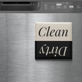 A black and white sign with the word "Clean" on it, placed on a stainless steel surface.