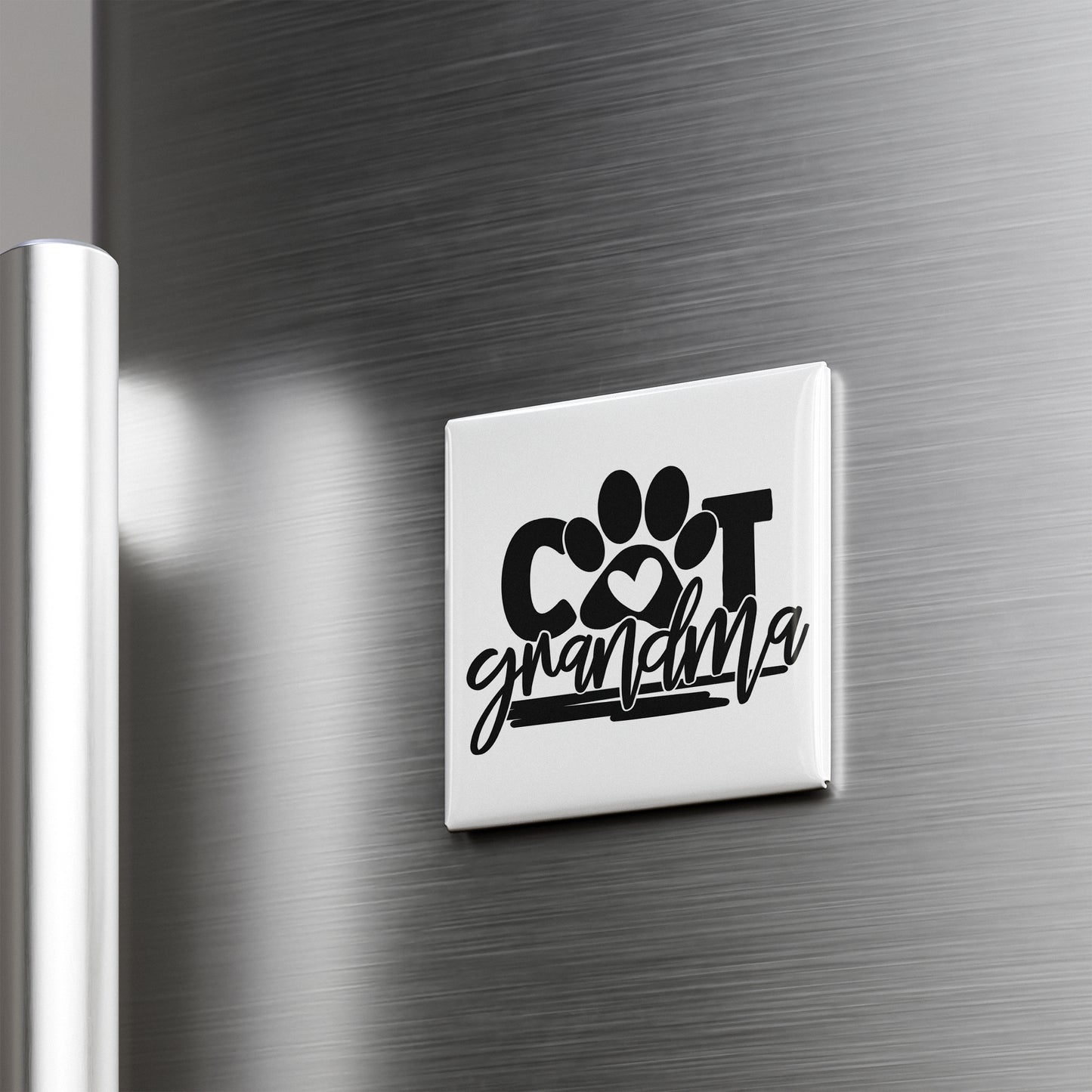 A refrigerator door with a sticker that says "COT grandmother" in a stylized font.