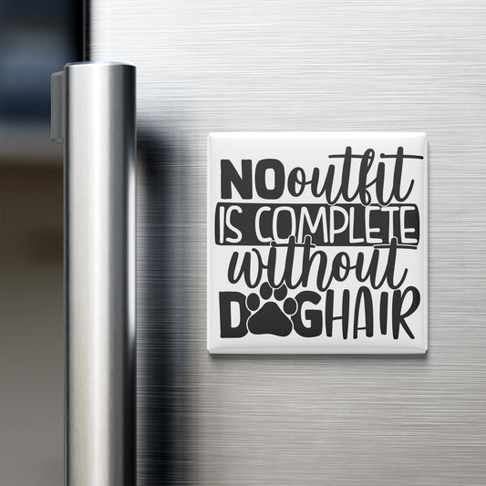 A white refrigerator magnet with black text that reads "NO outfit is complete without dog hair".