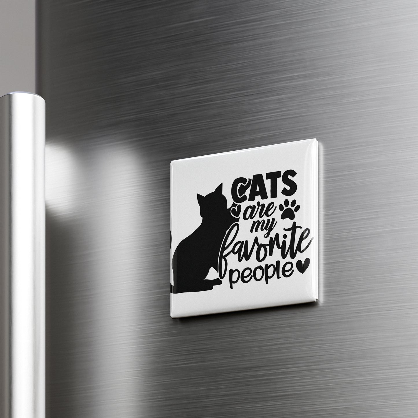 A refrigerator magnet with the text "CATS ARE MY FAVORITE PEOPLE" and a silhouette of a cat.