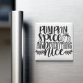 A white refrigerator magnet with the text "Pumpkin spice and everything nice" written on it.