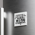 A white square magnet with the text "CUTEST APPLE IN THE ORCHARD" on it, mounted on a metallic surface.