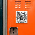 a sign that reads "fresh baked pies" on an orange wall.