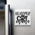A refrigerator door with a magnet that says "HELICOPTER COT MAMA" in a stylized font.