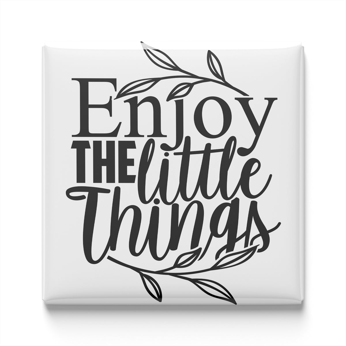 the text "Enjoy the little things" in a stylized font, surrounded by decorative leaves.